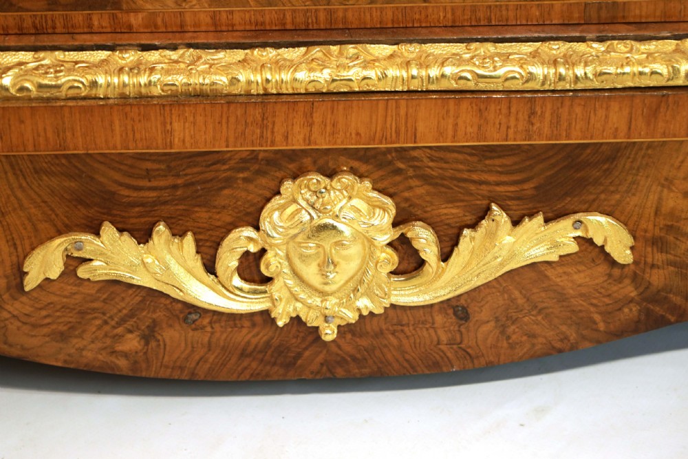 A pair of late nineteenth-century glazed display cabinets crafted from kingwood and walnut with decorative gilt-bronze mounts. View VII