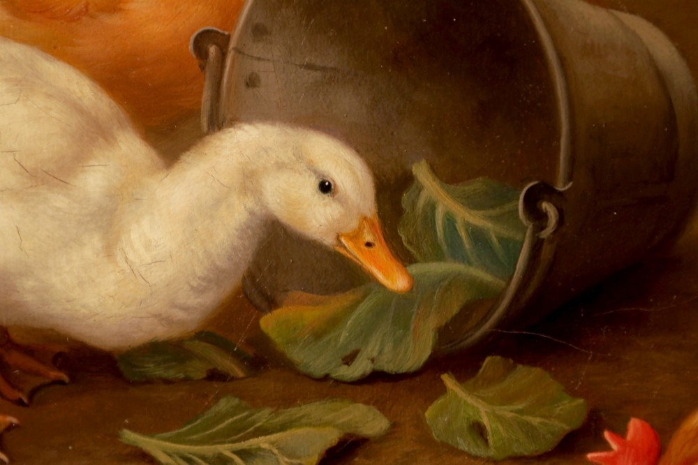 A framed oil painting depicting chickens, a cockerel, and ducks feeding outside a wooden barn, set within an ornate gilded frame. View X