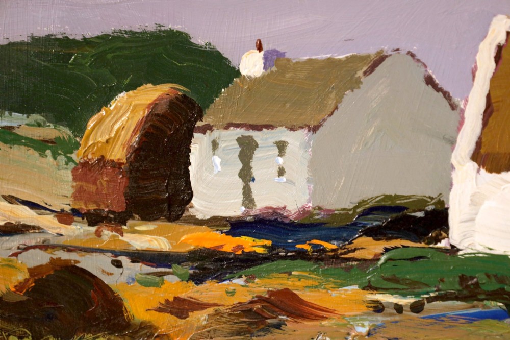 An original oil painting on board by Donald McIntyre depicting whitewashed coastal cottages with thatched roofs set in a green landscape, framed in a silver moulding. View V