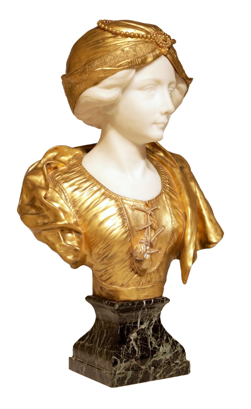 An Art Nouveau sculpture depicting a woman with a carved white alabaster face and neck, wearing a gilt bronze laced bodice and bonnet, set on a dark green veined marble base. View II