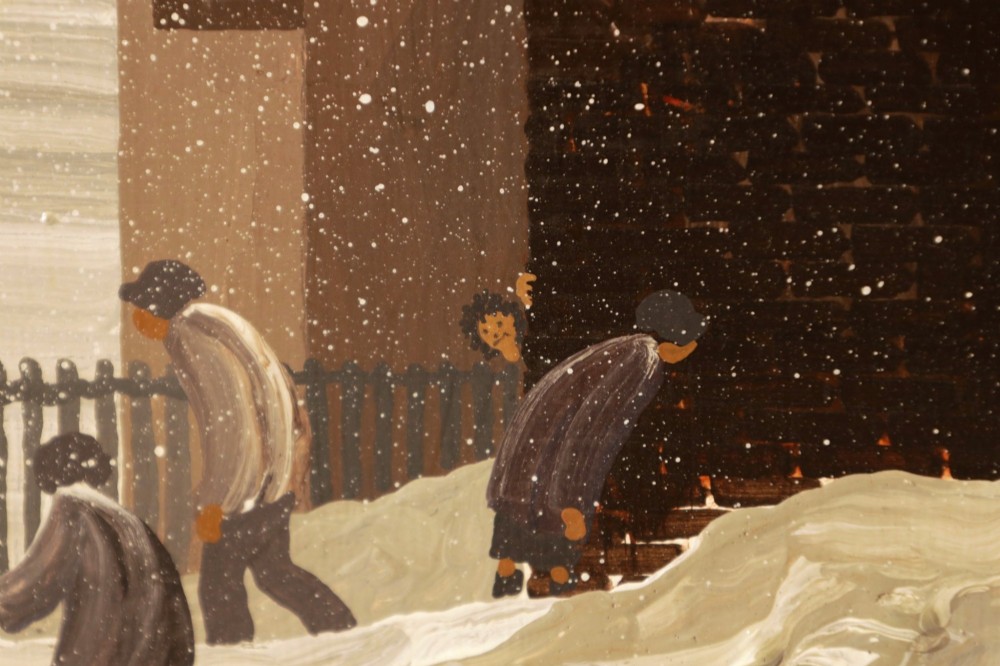 A framed oil painting on canvas depicting a snowy northern townscape with figures walking along a street lined with buildings leading towards a tall church spire. View VI