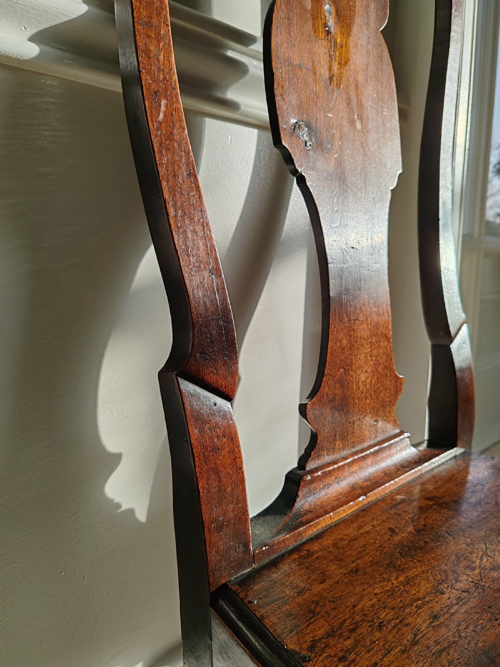 A mid-18th-century walnut side chair with a vase-shaped back splat, solid wooden seat, and front cabriole legs. View II