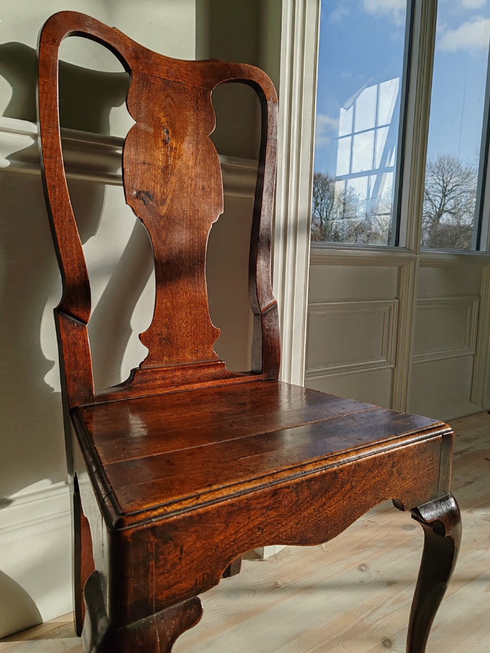 A mid-18th-century walnut side chair with a vase-shaped back splat, solid wooden seat, and front cabriole legs. View III