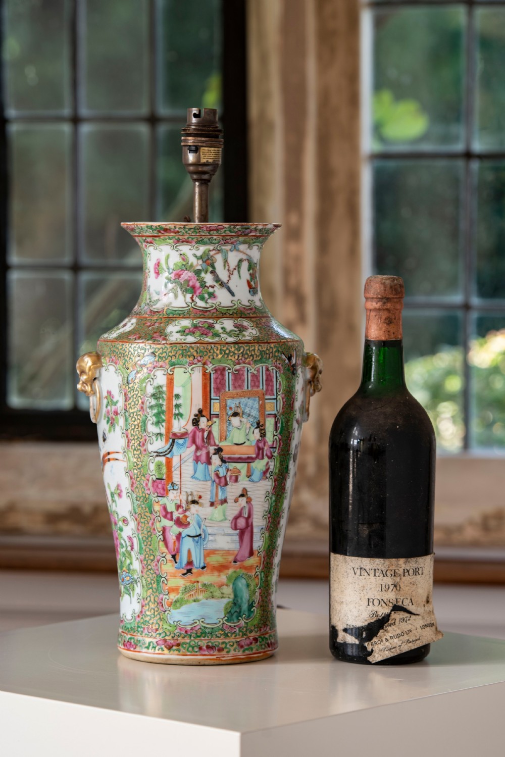 A pair of large Chinese Canton porcelain vase lamps with hand-painted polychrome figural panels, floral borders, and brass light fittings. View IV