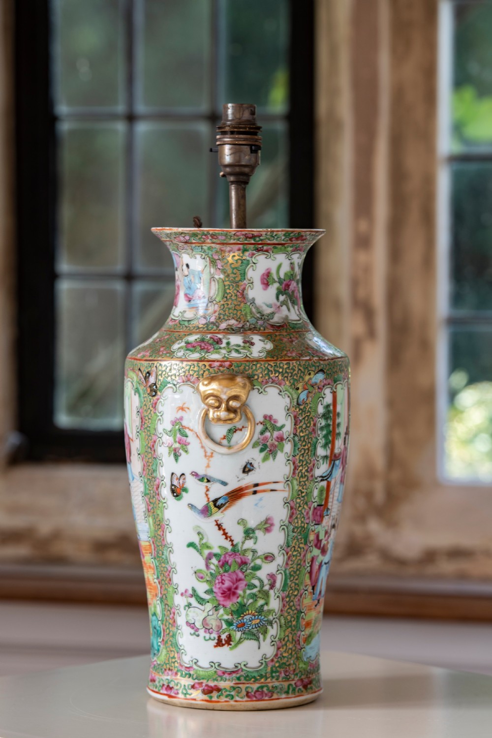 A pair of large Chinese Canton porcelain vase lamps with hand-painted polychrome figural panels, floral borders, and brass light fittings. View VIII
