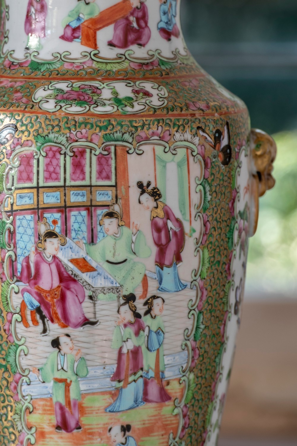 A pair of large Chinese Canton porcelain vase lamps with hand-painted polychrome figural panels, floral borders, and brass light fittings. View IX