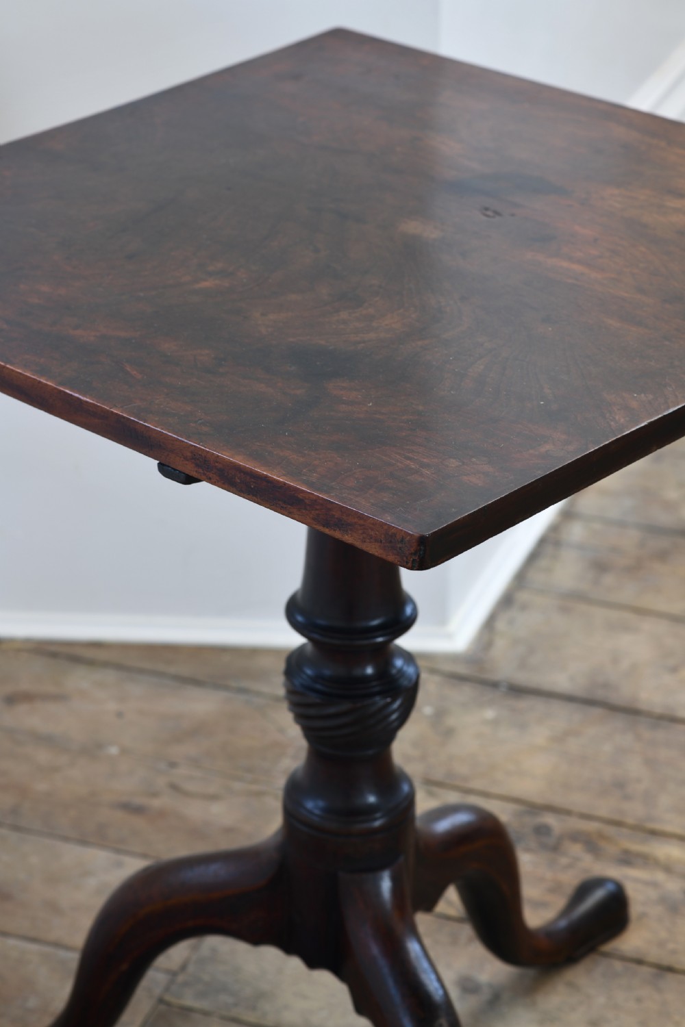 An 18th-century dark mahogany tripod table featuring a square top supported by a turned stem with a spiral baluster detail and three cabriole legs ending in pad feet. View III