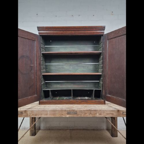 A late 18th-century Georgian oak wall cabinet featuring twin fielded panel doors, brass knobs, an escutcheon, and a moulded top cornice. View VIII