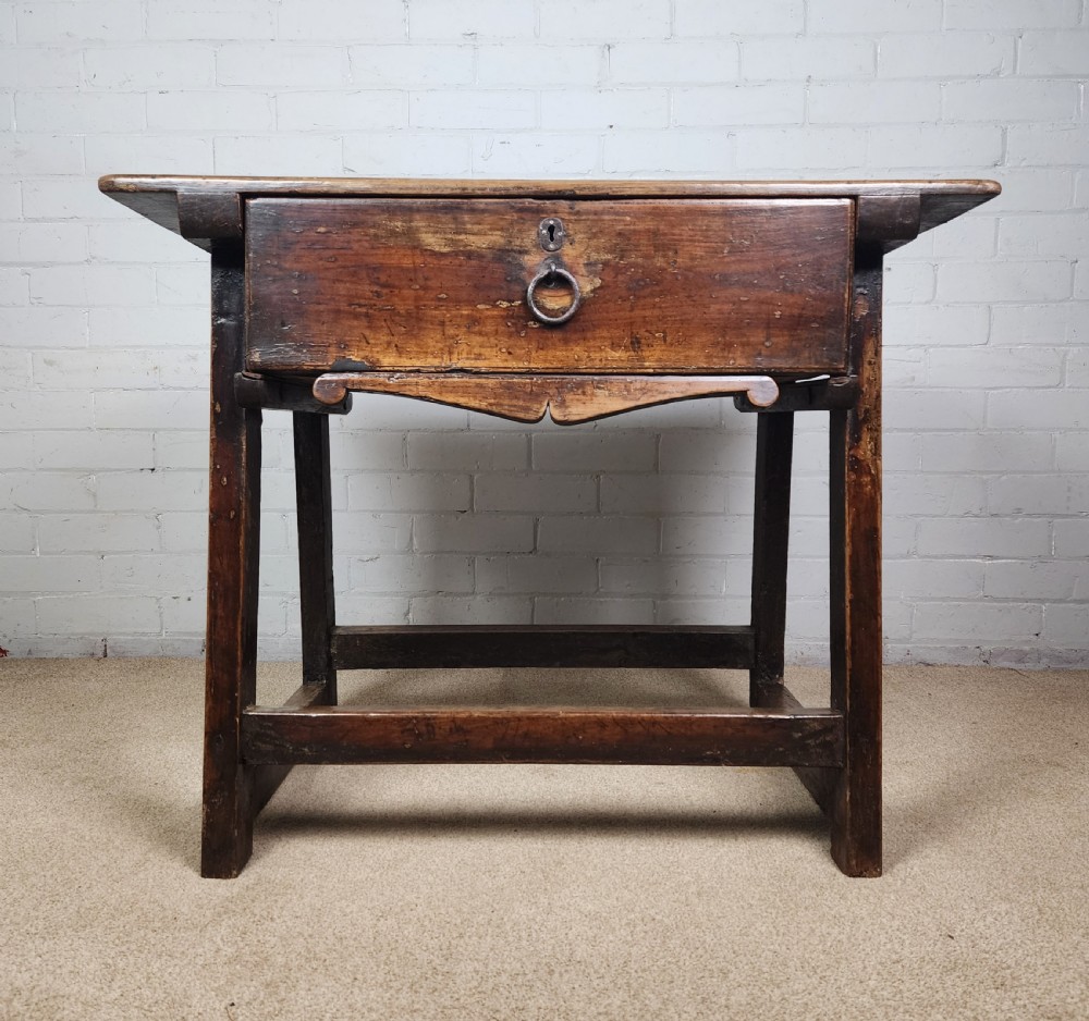 A 17th-century Spanish chestnut side table with a single drawer featuring a central wrought iron ring pull and a box stretcher base. View XIII