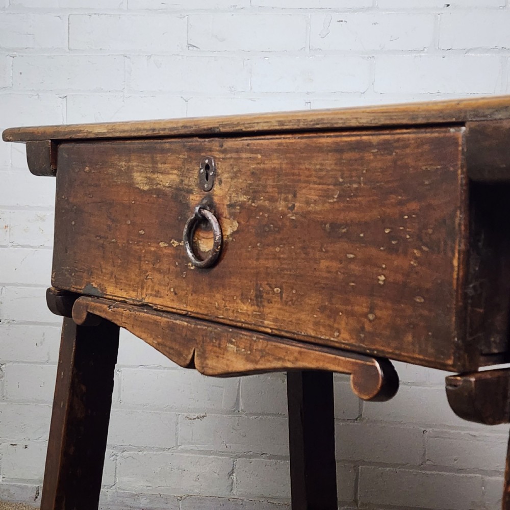 A 17th-century Spanish chestnut side table with a single drawer featuring a central wrought iron ring pull and a box stretcher base. View III