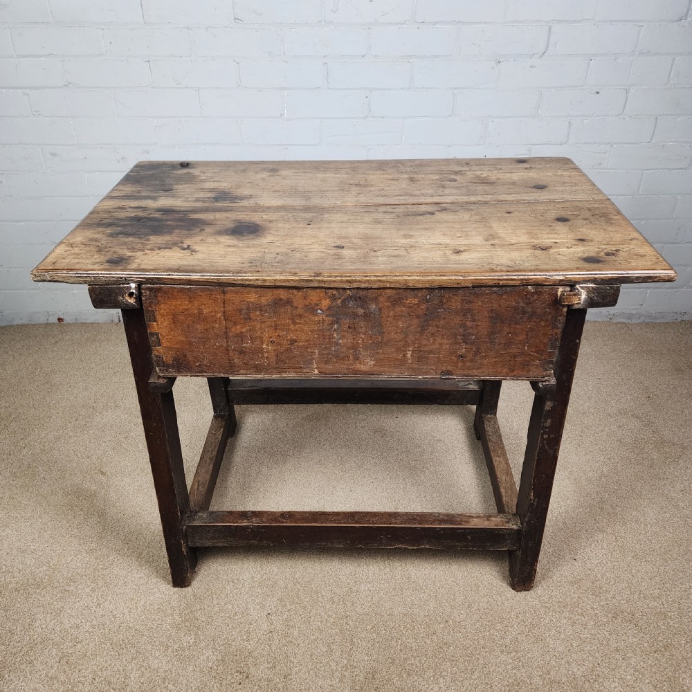 A 17th-century Spanish chestnut side table with a single drawer featuring a central wrought iron ring pull and a box stretcher base. View VIII