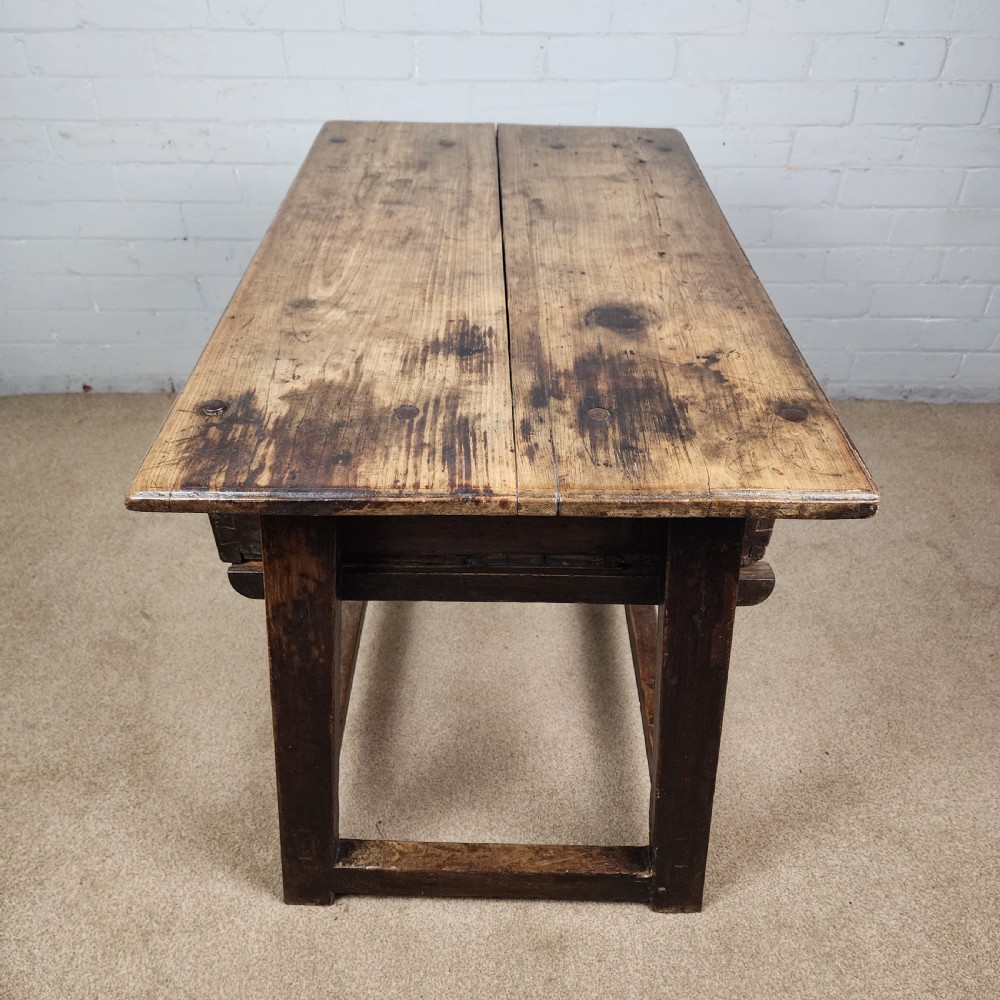 A 17th-century Spanish chestnut side table with a single drawer featuring a central wrought iron ring pull and a box stretcher base. View IX