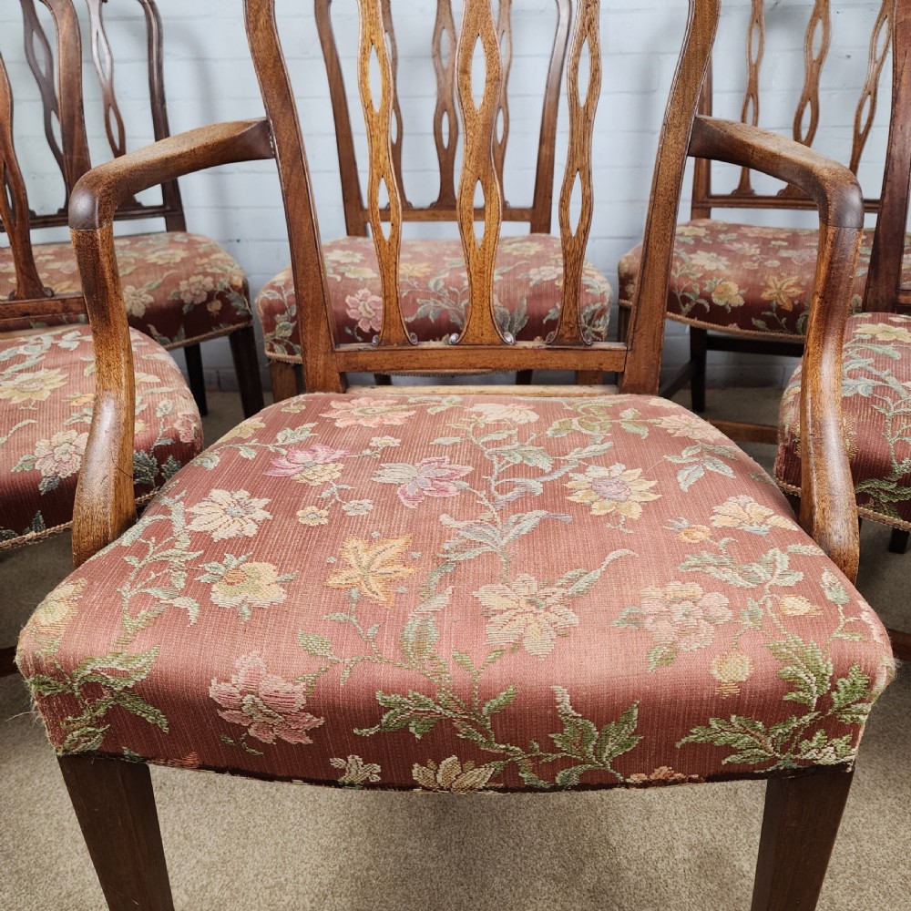 A set of six early 19th-century Georgian mahogany dining chairs with carved pierced splats and floral upholstered seats, including two carver armchairs. View II
