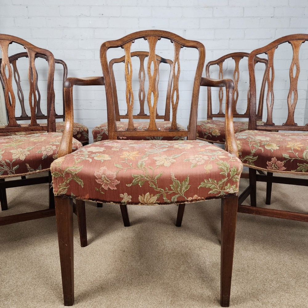 A set of six early 19th-century Georgian mahogany dining chairs with carved pierced splats and floral upholstered seats, including two carver armchairs. View III