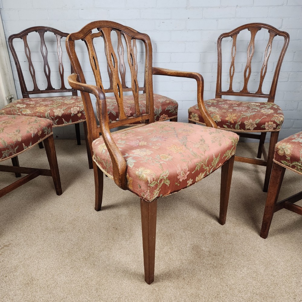 A set of six early 19th-century Georgian mahogany dining chairs with carved pierced splats and floral upholstered seats, including two carver armchairs. View IV