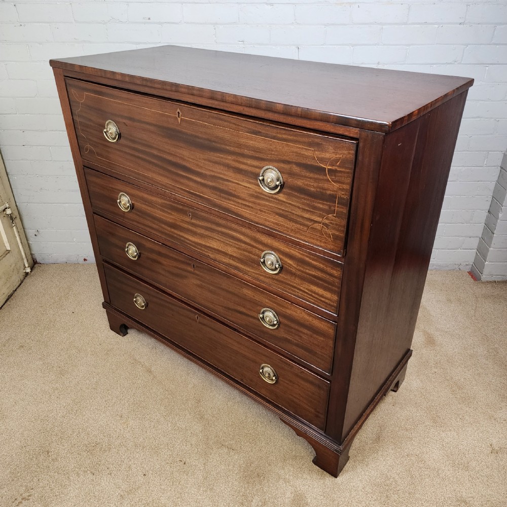 A Georgian mahogany secretaire chest of drawers featuring an open drop-front top section with small fitted drawers and pigeonholes above three lower drawers. View VIII