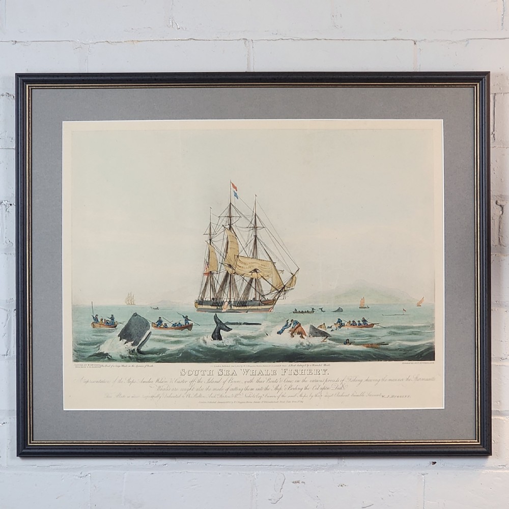 A framed nineteenth-century aquatint print depicting whaling ships and longboats in an oceanic scene, presented within a grey mount and black frame with gilt accents.