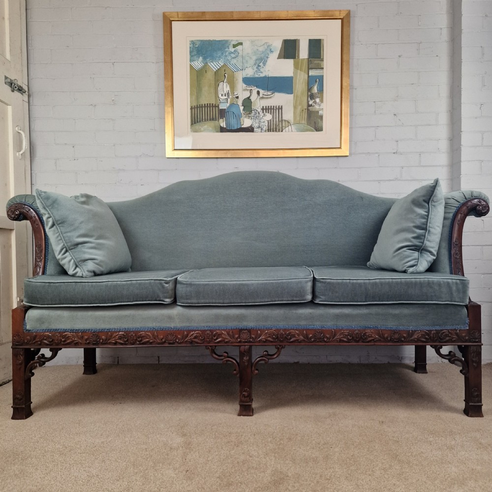 An early twentieth-century Chinese Chippendale style camelback sofa upholstered in light blue velvet with a hand-carved mahogany frame and fretwork legs. View VII