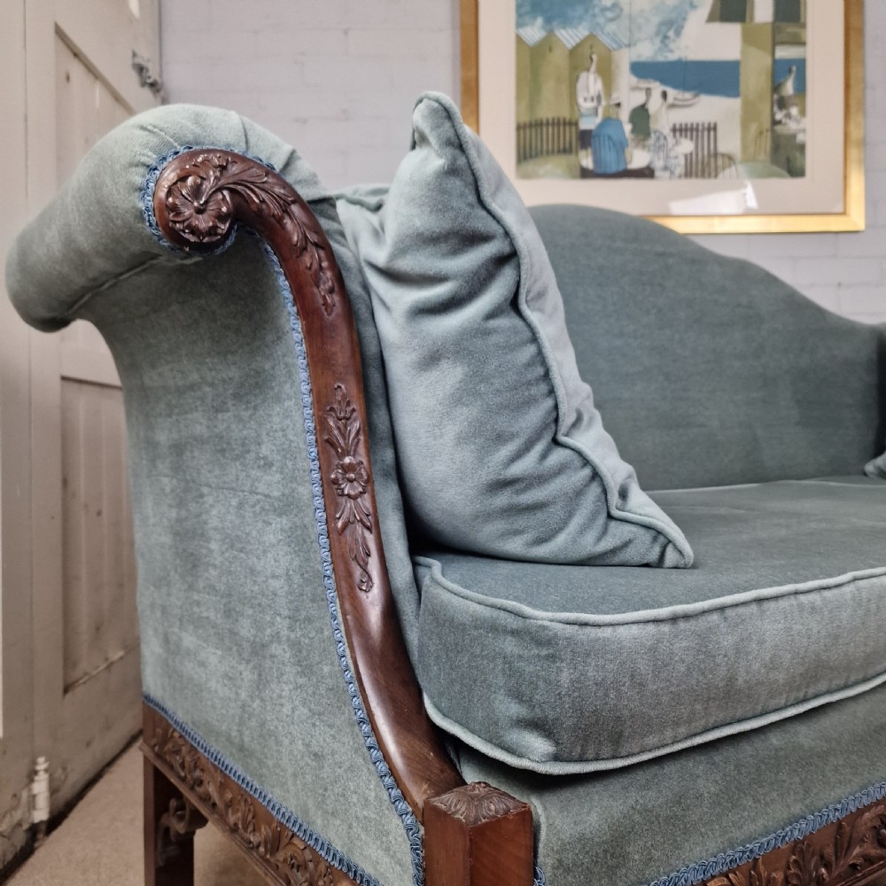 An early twentieth-century Chinese Chippendale style camelback sofa upholstered in light blue velvet with a hand-carved mahogany frame and fretwork legs. View VIII