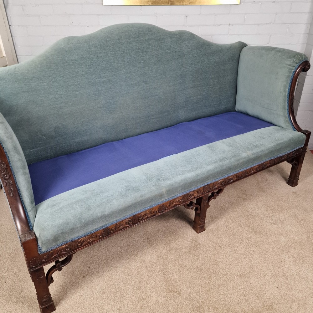An early twentieth-century Chinese Chippendale style camelback sofa upholstered in light blue velvet with a hand-carved mahogany frame and fretwork legs. View IX