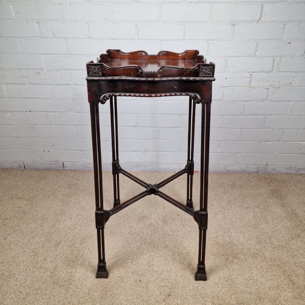 A tall, slender late 18th-century Chinese Chippendale style dark mahogany kettle stand featuring a carved gallery top, clustered column legs, and an X-frame stretcher. View III
