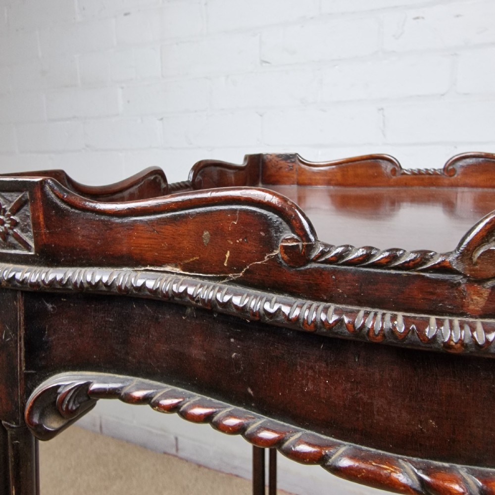 A tall, slender late 18th-century Chinese Chippendale style dark mahogany kettle stand featuring a carved gallery top, clustered column legs, and an X-frame stretcher. View V