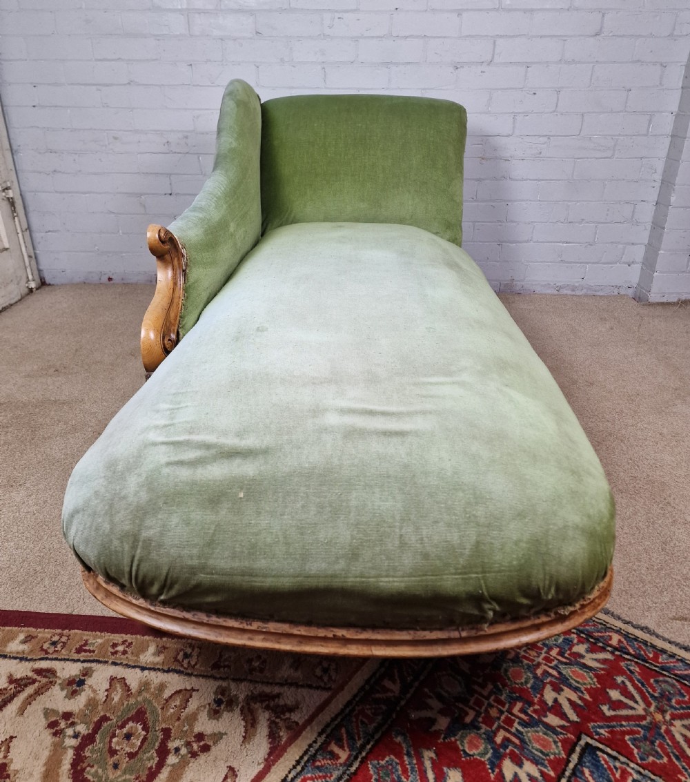 A Victorian Mahogany Chaise Longue with Ceramic Castors View II