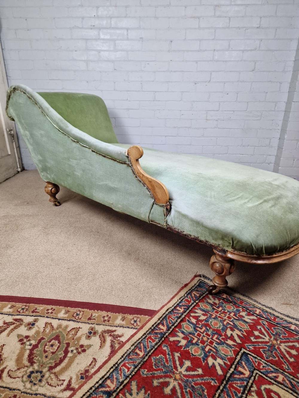 A Victorian Mahogany Chaise Longue with Ceramic Castors View III