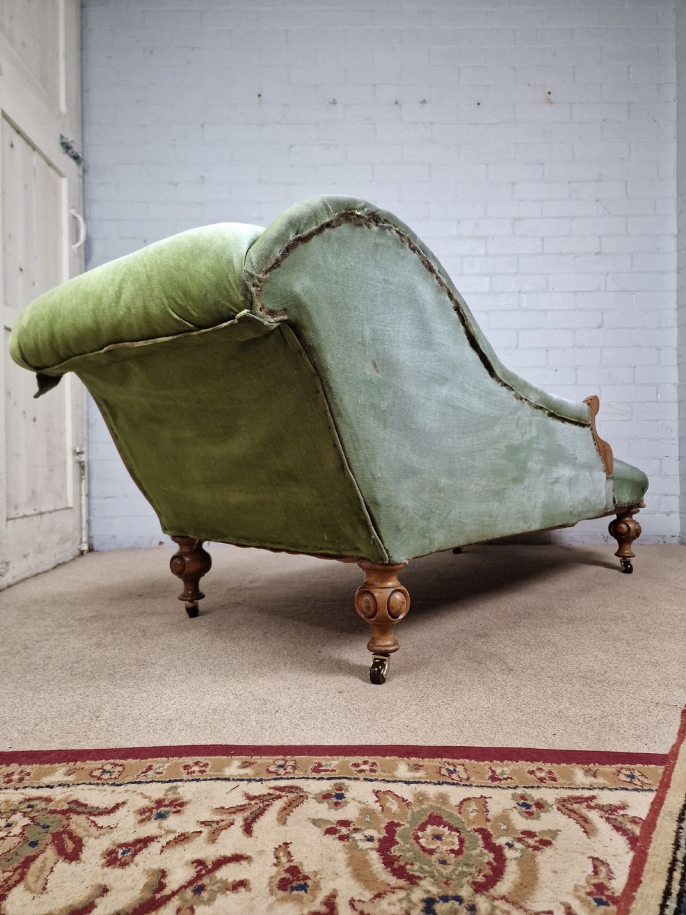 A Victorian Mahogany Chaise Longue with Ceramic Castors View V