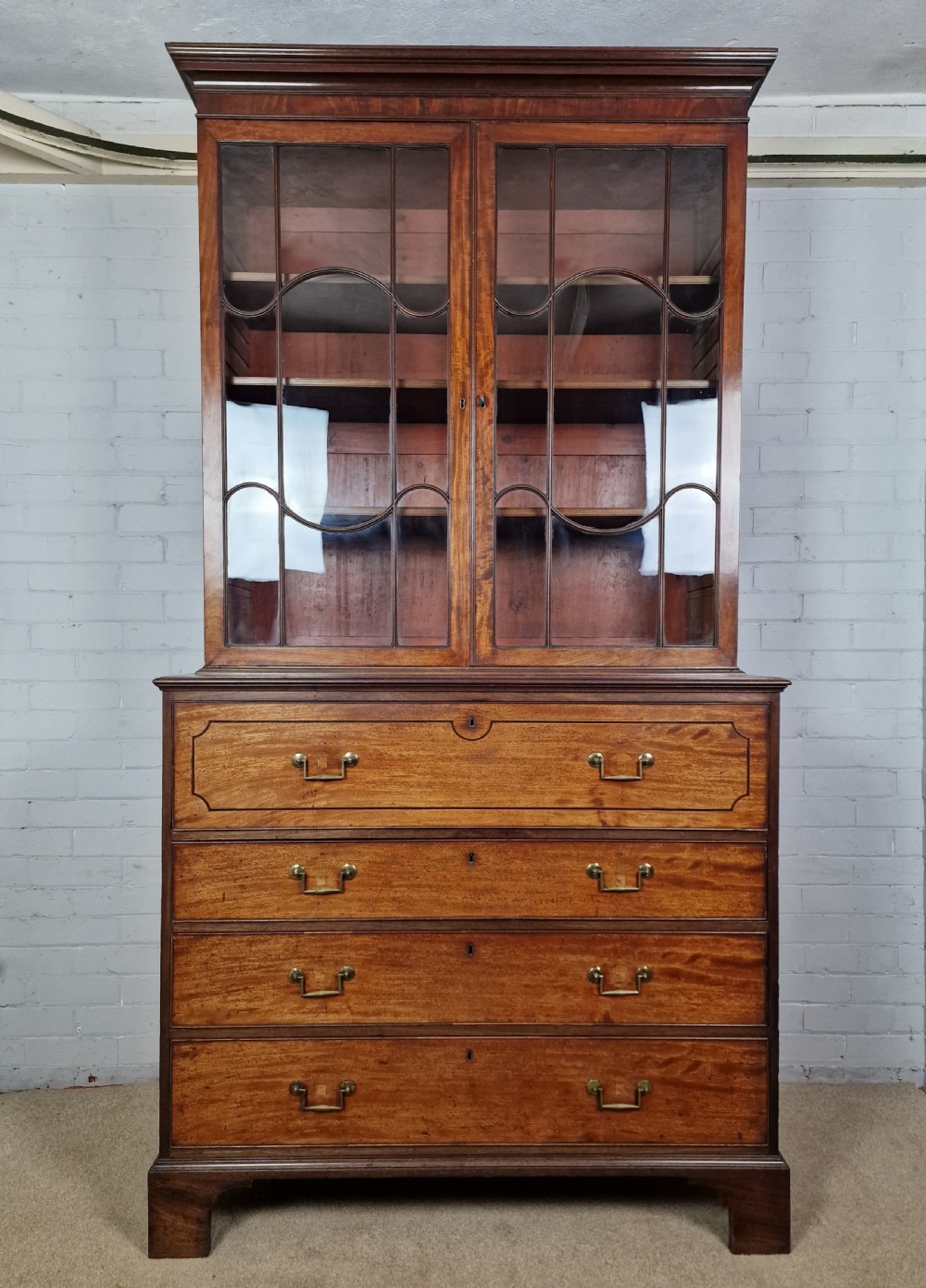 A Late George III Mahogany, Purple Heart and Boxwood-Strung Secretaire Bookcase