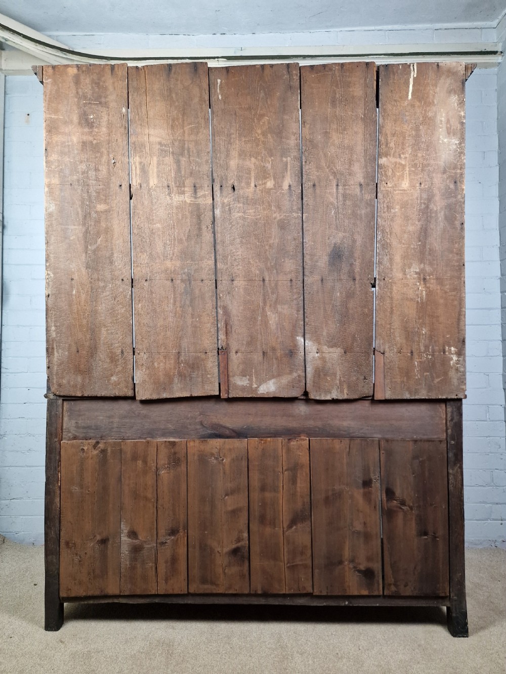 An 18th-century George II oak dresser featuring a top open plate rack above three frieze drawers and an open lower pot shelf. View VII
