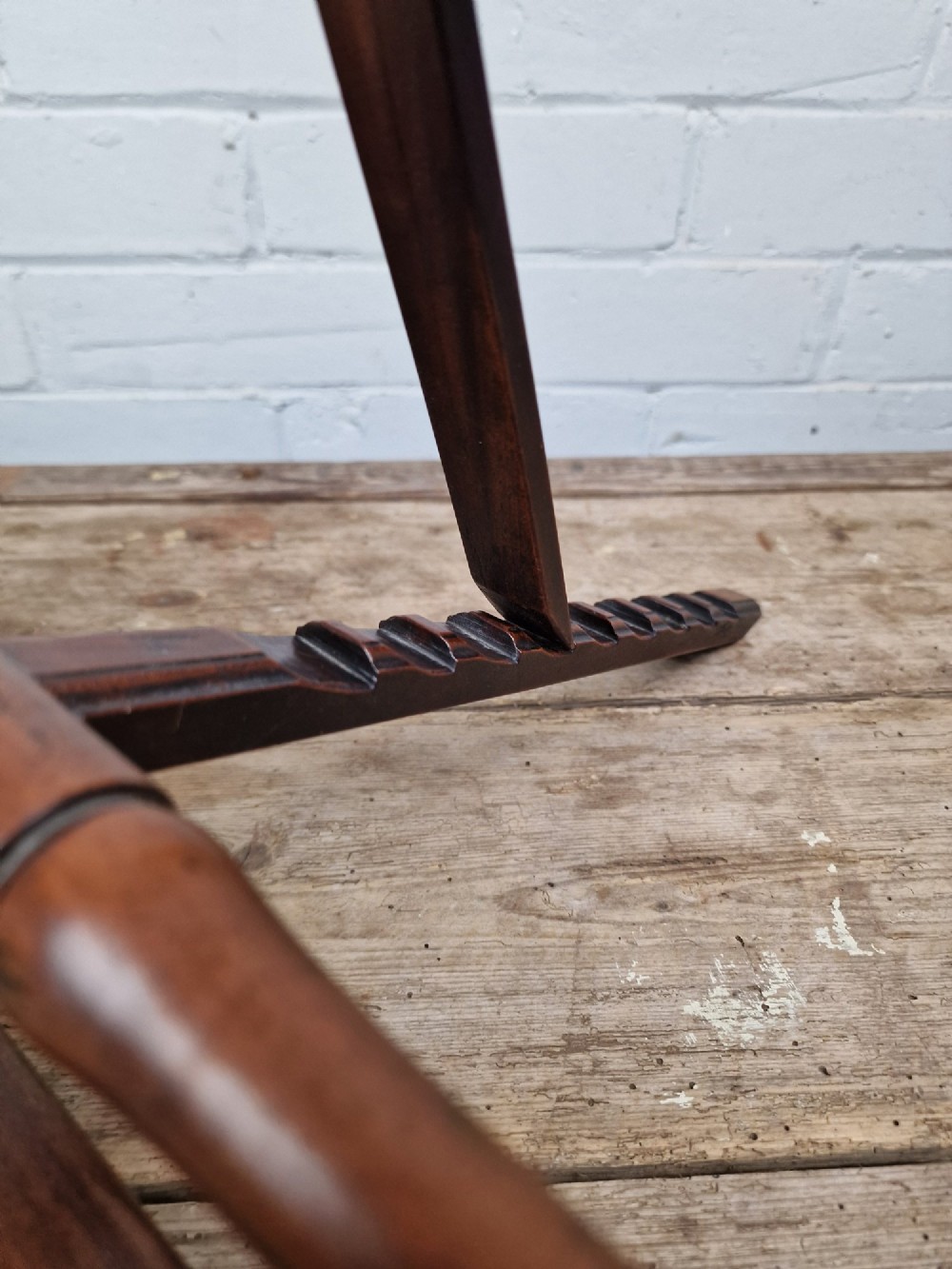 A nineteenth-century mahogany table-top easel featuring turned wooden side supports, finials, a front shelf ledge, and an adjustable rear prop stand. View II