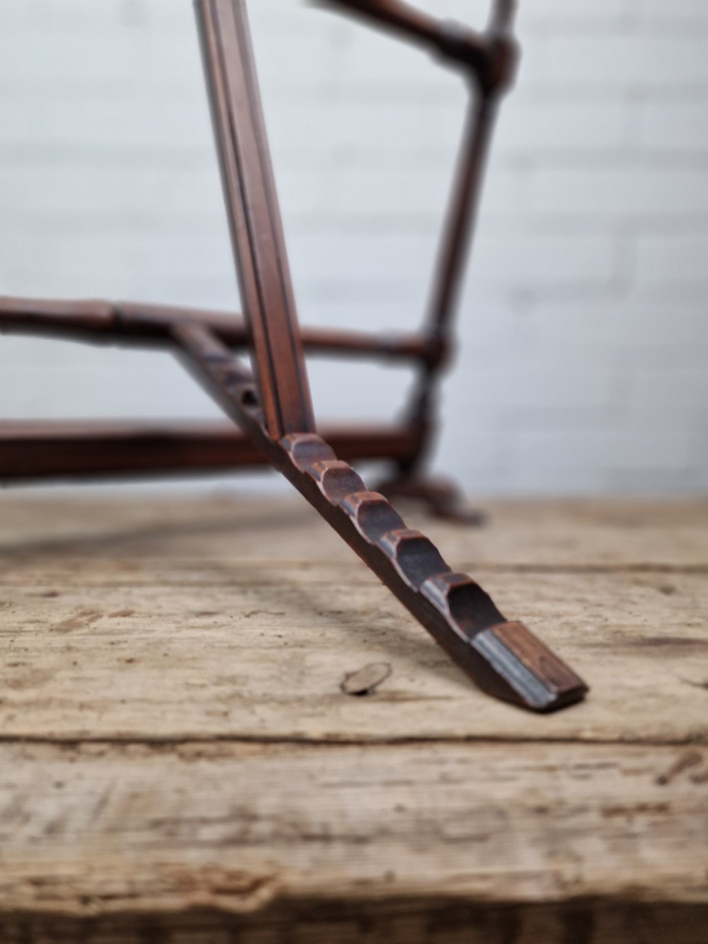 A nineteenth-century mahogany table-top easel featuring turned wooden side supports, finials, a front shelf ledge, and an adjustable rear prop stand. View III