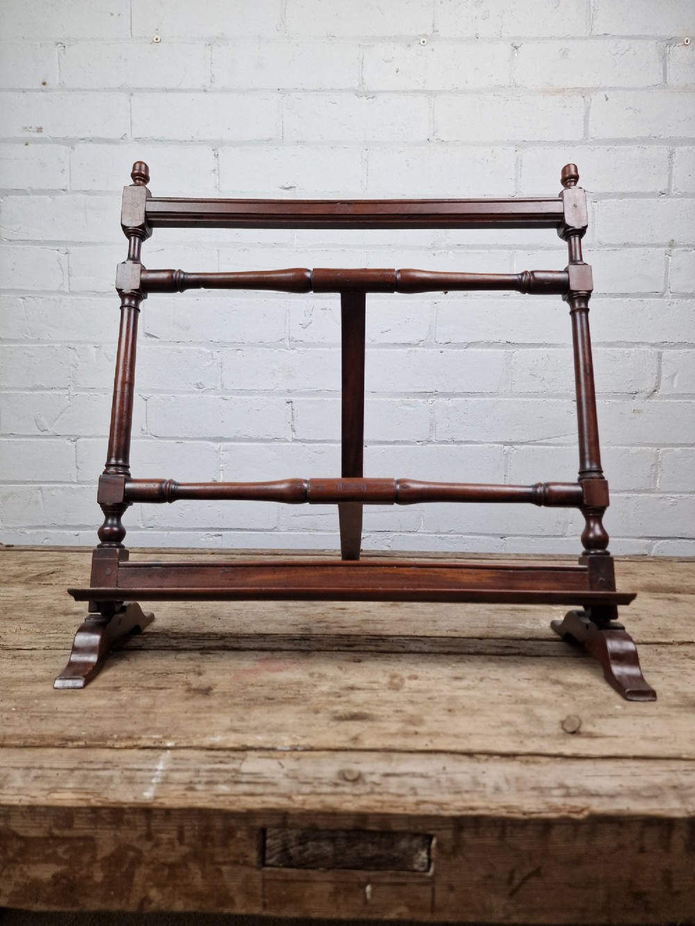 A nineteenth-century mahogany table-top easel featuring turned wooden side supports, finials, a front shelf ledge, and an adjustable rear prop stand. View VIII