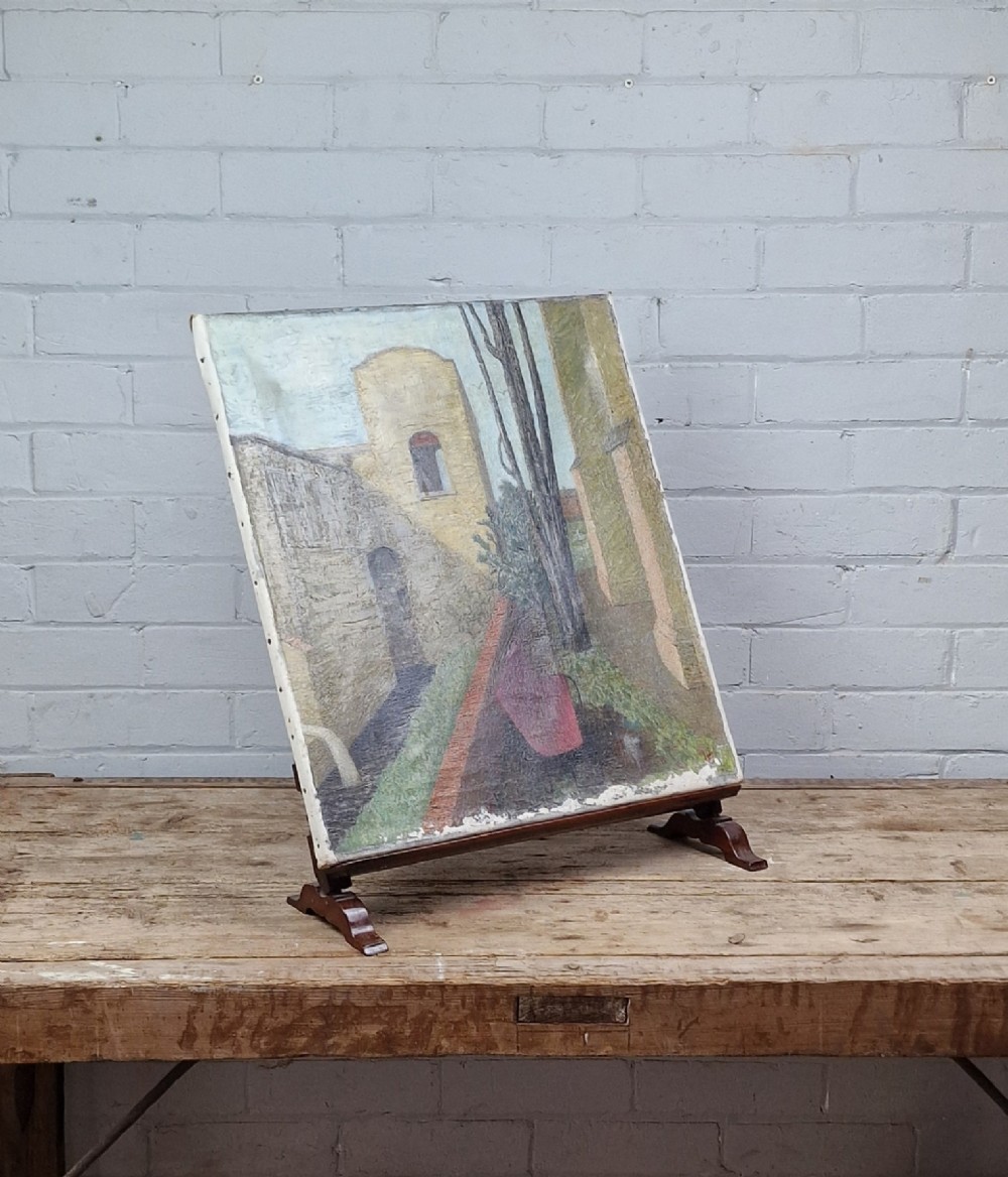 A nineteenth-century mahogany table-top easel featuring turned wooden side supports, finials, a front shelf ledge, and an adjustable rear prop stand. View XI