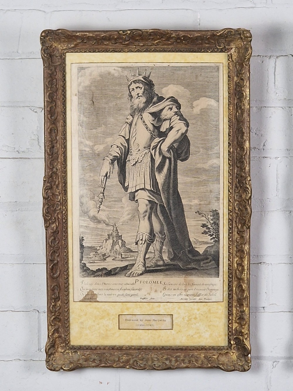A pair of framed monochrome antique engravings depicting classical male figures set within carved ornate giltwood frames. View II