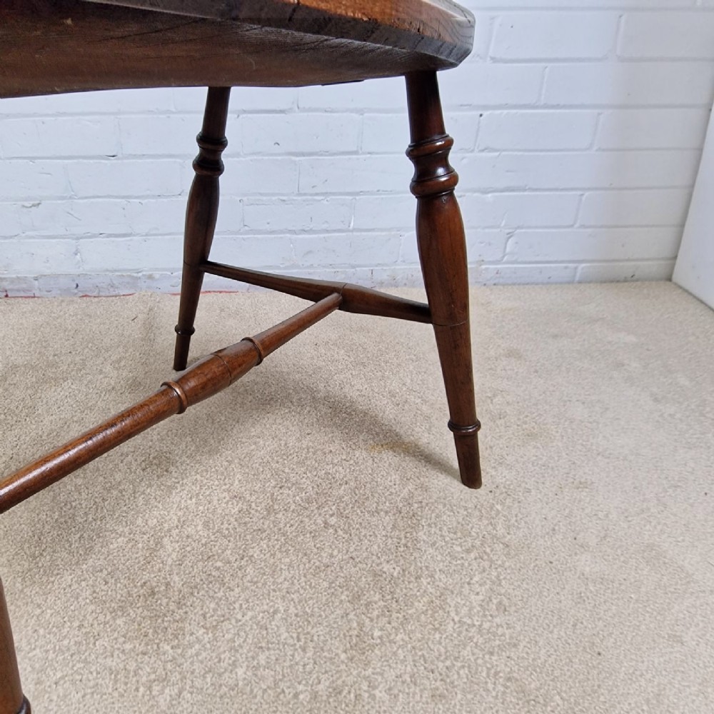 A mid-19th-century wooden Mendlesham armchair featuring a squared backrest with turned wooden spheres, pierced splats, curved arms, and a shaped seat on turned legs. View IX
