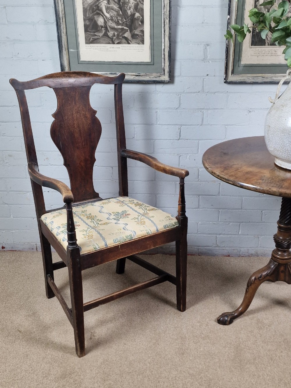 A late eighteenth-century dark oak armchair featuring a vase-shaped splat back, turned arm supports, and a patterned floral fabric drop-in seat. View XI