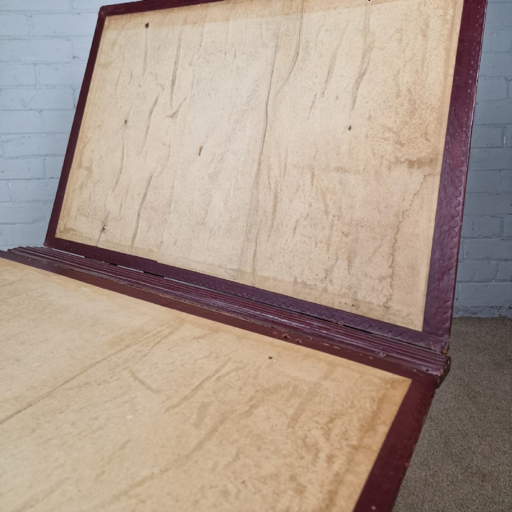 A late 19th-century mahogany folio stand with burgundy leather panels, an adjustable brass ratchet arm, and a wooden trestle frame. View III
