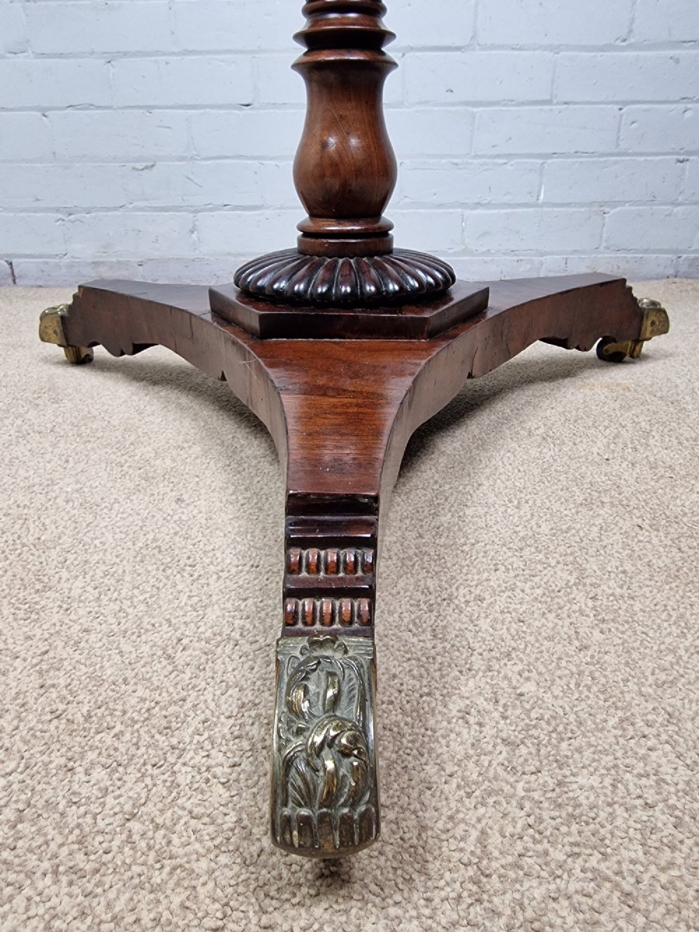 A tall late Georgian mahogany coat stand featuring turned and reeded central pillars, curved hanging hooks, and a splayed tripod base with brass castors. View IV