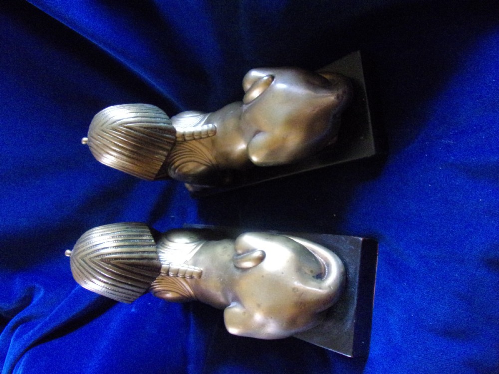 A pair of late 19th-century gilt bronze sphinxes wearing nemes headcloths, mounted on rectangular black marble bases. View V