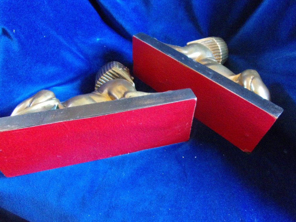 A pair of late 19th-century gilt bronze sphinxes wearing nemes headcloths, mounted on rectangular black marble bases. View VI