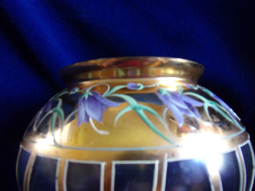 An Art Nouveau footed glass vase featuring a wide gilded collar, hand-painted purple enamel bellflowers, green foliage, and geometric lower panelling. View III