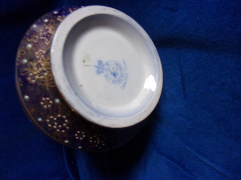 An antique Carlton Ware ceramic claret jug featuring floral enamel detailing and a polished silver-plated neck, lid, and geometric handle. View IV