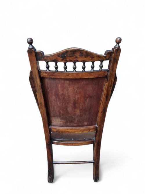 fig 1. An Edwardian beech occasional chair featuring floral marquetry on the backrest and seat, turned front legs, and decorative brass studs.