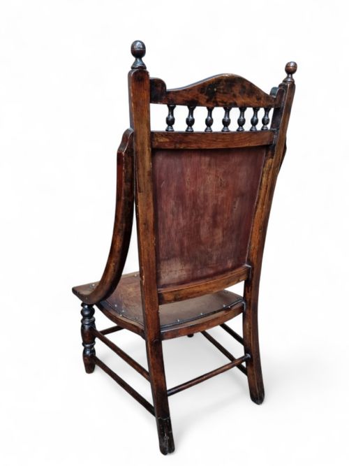 fig 2. An Edwardian beech occasional chair featuring floral marquetry on the backrest and seat, turned front legs, and decorative brass studs.