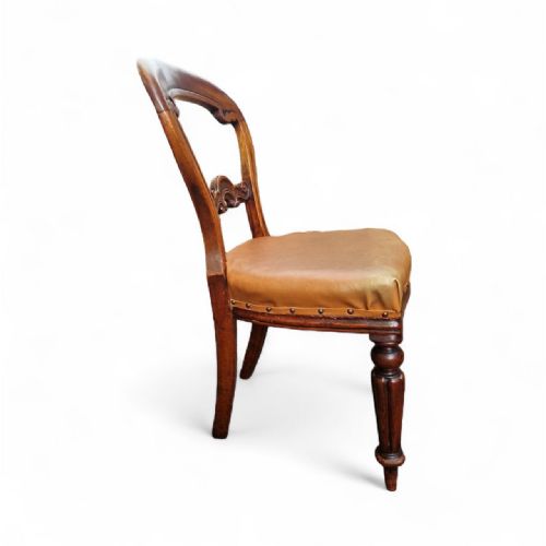 fig 1. Set of six Victorian balloon back dining chairs featuring carved timber frames, turned front legs, and brown leather seats.