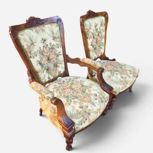 fig 2. A pair of Victorian carved walnut salon chairs upholstered in green floral tapestry fabric, comprising one armchair and one armless slipper chair.