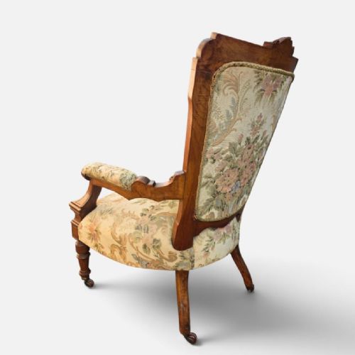 fig 3. A pair of Victorian carved walnut salon chairs upholstered in green floral tapestry fabric, comprising one armchair and one armless slipper chair.