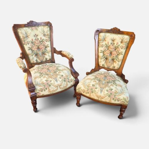fig 4. A pair of Victorian carved walnut salon chairs upholstered in green floral tapestry fabric, comprising one armchair and one armless slipper chair.
